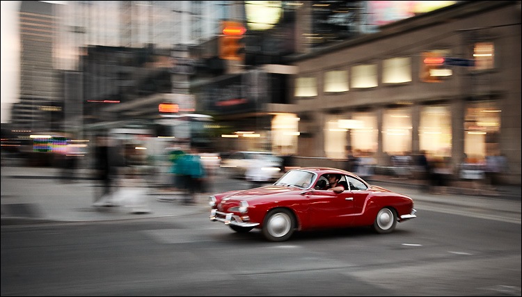 panning_red_2-seater_car_yonge-dundas.jpg